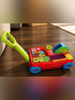 Vintage Fisher-Price Peek-a-boo Pull Toy with Green Handle and Blue Wheels